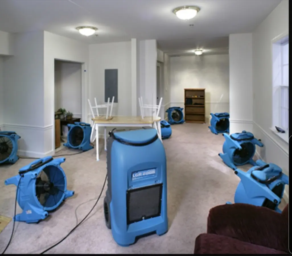 Air movers and dehumidifier setup for Water Damage Restoration in Edwards